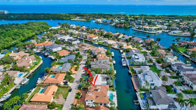 birds eye view of property featuring a water view