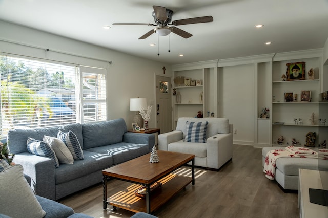 living room with ceiling fan and hardwood / wood-style flooring