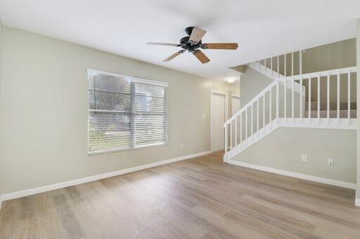 interior space with light hardwood / wood-style floors and ceiling fan