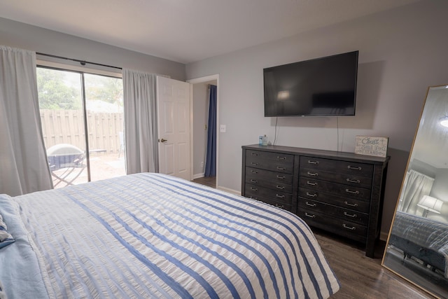 bedroom with dark hardwood / wood-style flooring and access to outside