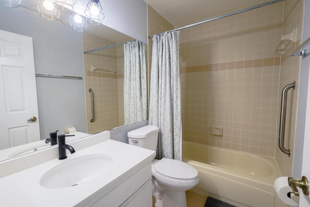 full bathroom featuring tile patterned floors, vanity, shower / bath combination with curtain, and toilet