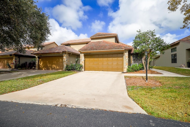 view of front facade featuring a front yard and a garage