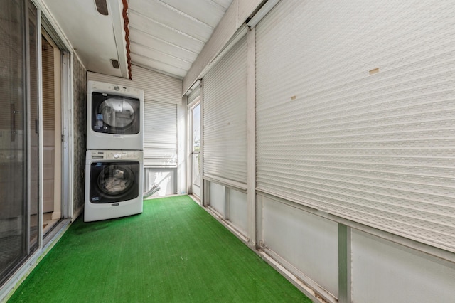 washroom with stacked washer and clothes dryer