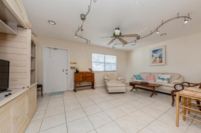 tiled living room featuring ceiling fan