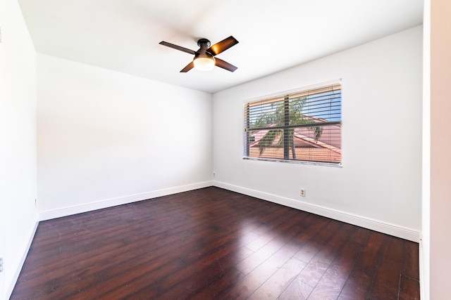 unfurnished room featuring ceiling fan and dark wood-type flooring