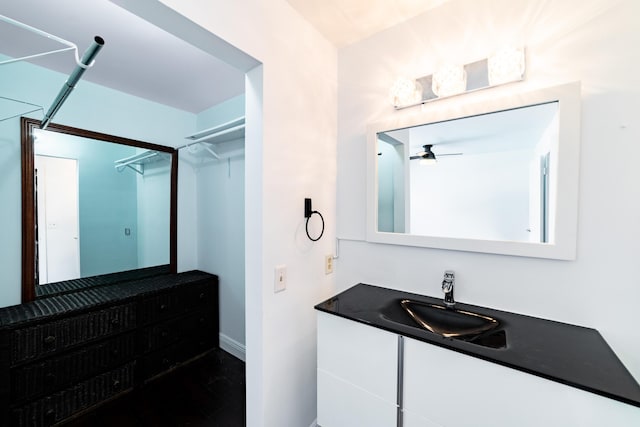 bathroom featuring ceiling fan and vanity