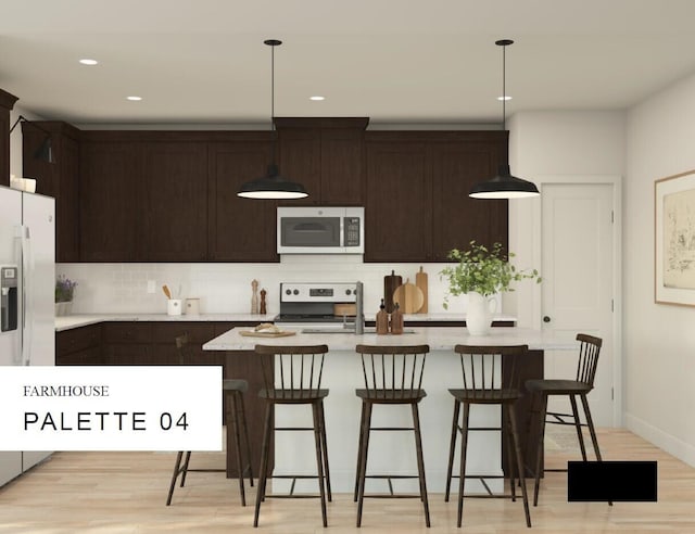 kitchen with backsplash, hanging light fixtures, stainless steel appliances, and light wood-type flooring