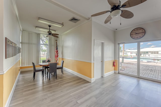 dining room with ceiling fan, light wood-type flooring, and a wealth of natural light