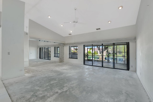 unfurnished living room with ceiling fan and high vaulted ceiling