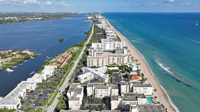 aerial view with a water view and a view of the beach