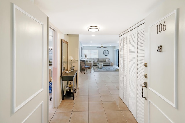 hall featuring light tile patterned flooring