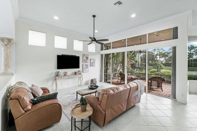 living room featuring ceiling fan, ornamental molding, and light tile patterned flooring