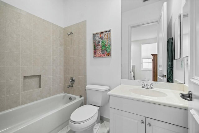 full bathroom featuring vanity, toilet, and tiled shower / bath combo