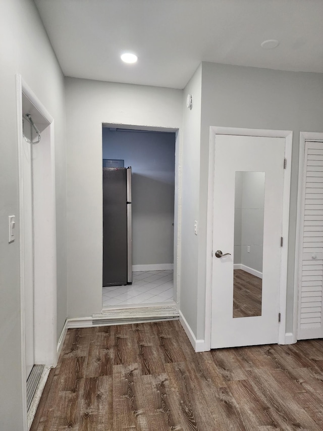 hallway featuring hardwood / wood-style floors