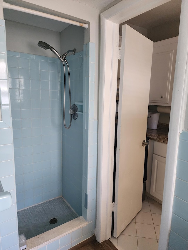 bathroom featuring a tile shower and tile patterned floors