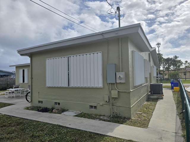 view of home's exterior featuring a patio and central air condition unit