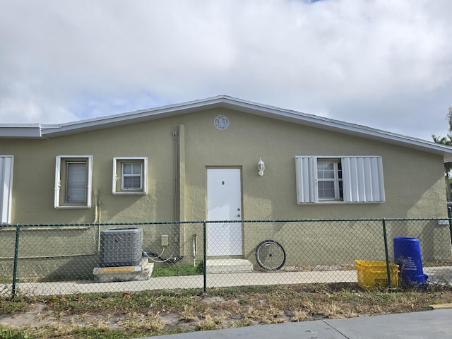 view of side of property with cooling unit