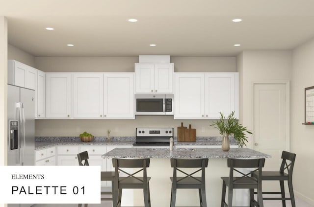 kitchen featuring white cabinetry, a kitchen breakfast bar, an island with sink, and appliances with stainless steel finishes