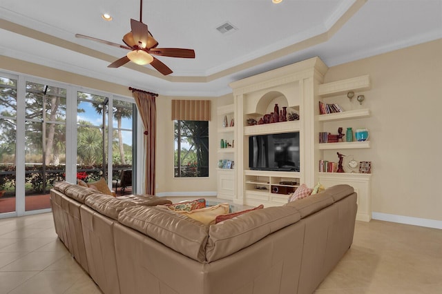 living room with built in shelves, ceiling fan, light tile patterned floors, and ornamental molding