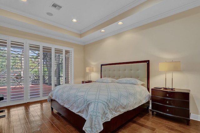 bedroom with access to exterior, dark hardwood / wood-style flooring, and ornamental molding