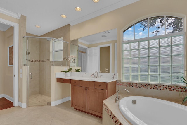 bathroom with tile patterned floors, vanity, shower with separate bathtub, and crown molding