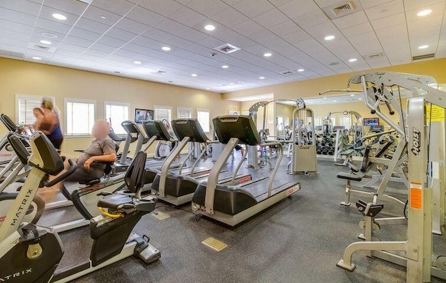 workout area featuring a paneled ceiling