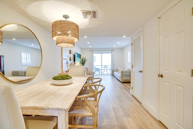 dining room featuring light hardwood / wood-style flooring