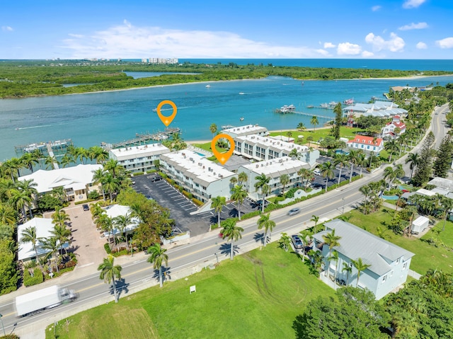 birds eye view of property with a water view