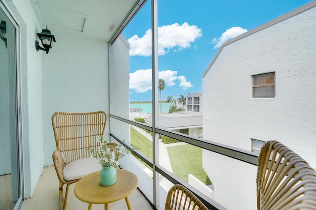 balcony featuring a water view