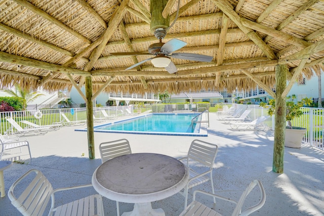 view of swimming pool with a gazebo, ceiling fan, and a patio area