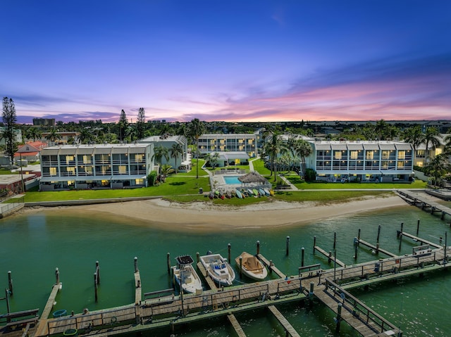 aerial view at dusk with a water view