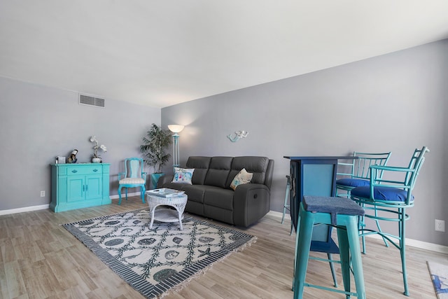 living room with light hardwood / wood-style floors