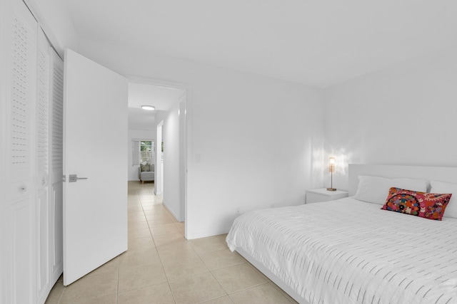 bedroom featuring light tile patterned floors