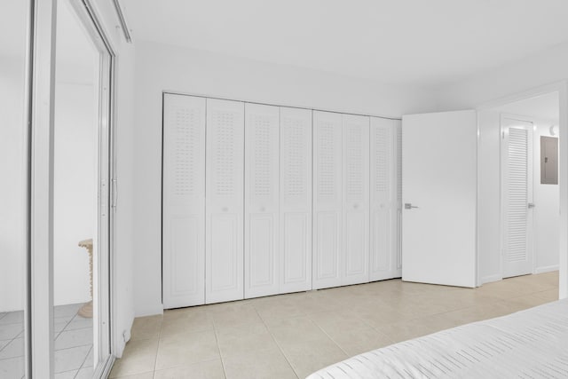 tiled bedroom with electric panel