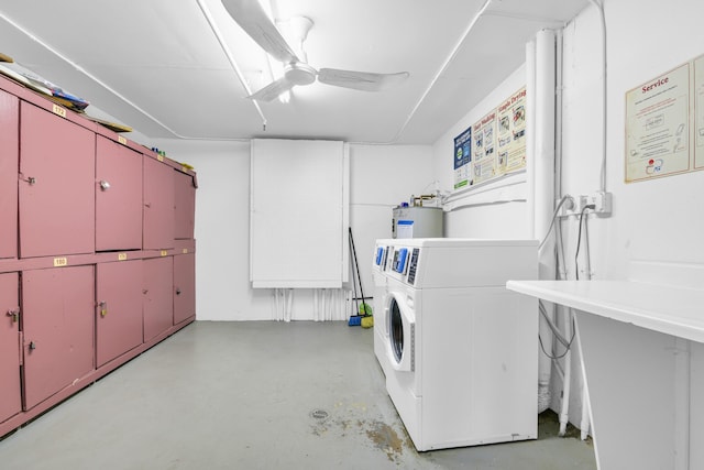 clothes washing area featuring ceiling fan, cabinets, separate washer and dryer, and water heater