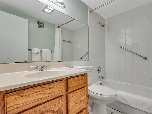 full bathroom featuring tile patterned floors, vanity, toilet, and shower / tub combo with curtain