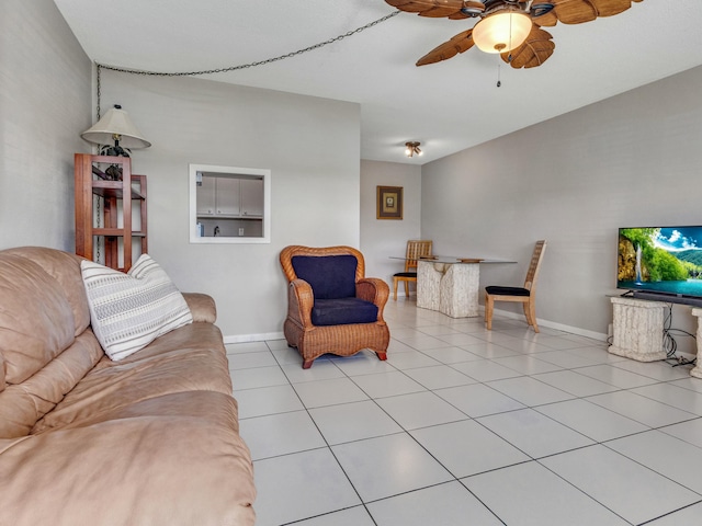 tiled living room featuring ceiling fan