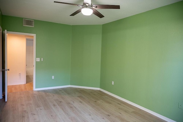 spare room with light hardwood / wood-style floors and ceiling fan