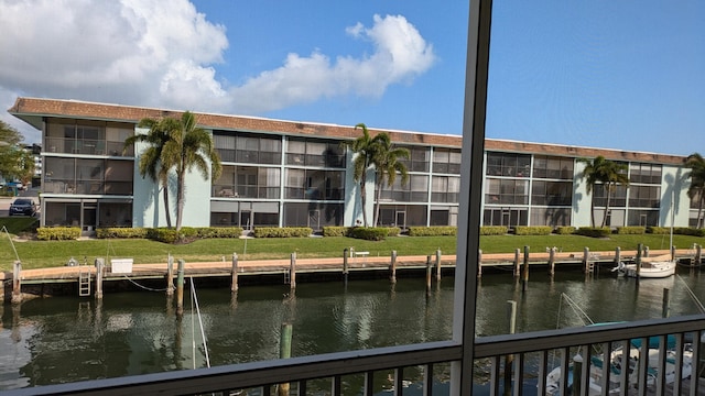 exterior space featuring a water view and a yard