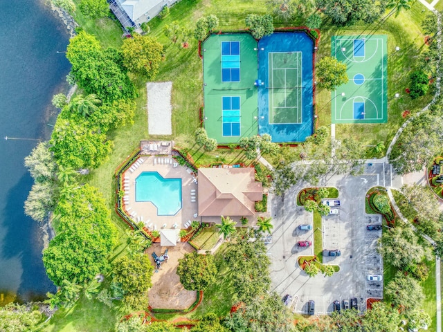 birds eye view of property with a water view