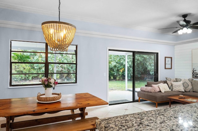 interior space with plenty of natural light, ornamental molding, and ceiling fan with notable chandelier