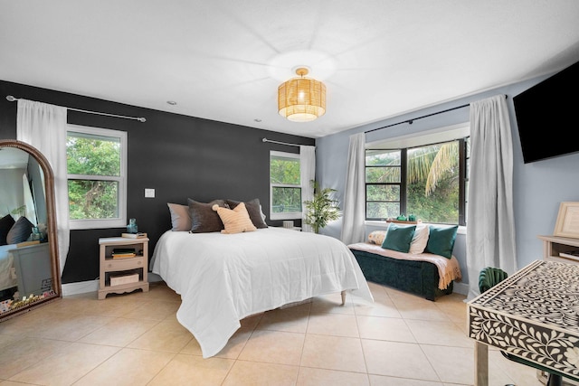 tiled bedroom with multiple windows