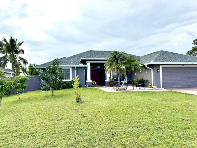 ranch-style home featuring a front yard, a garage, and a patio area