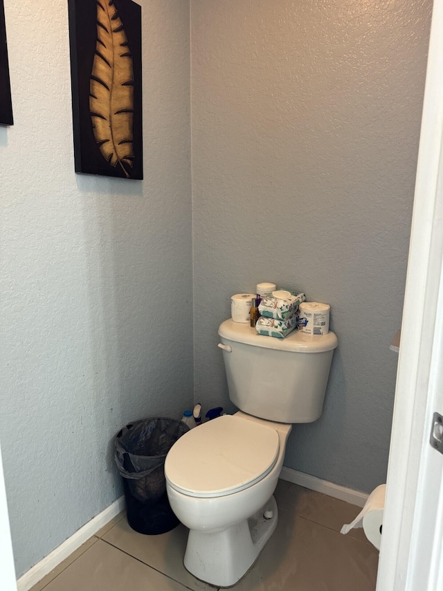 bathroom with tile patterned flooring and toilet