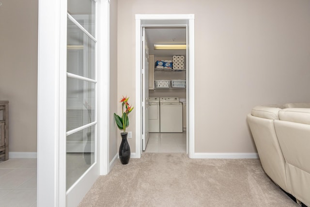 interior space featuring washer and dryer and light colored carpet