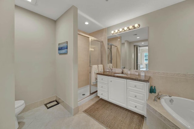 full bathroom featuring tile patterned flooring, shower with separate bathtub, vanity, and toilet