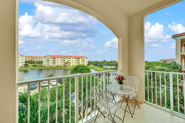 balcony featuring a water view