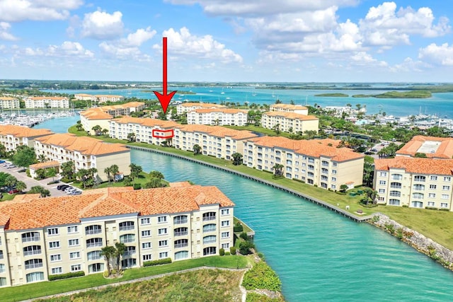 birds eye view of property featuring a water view