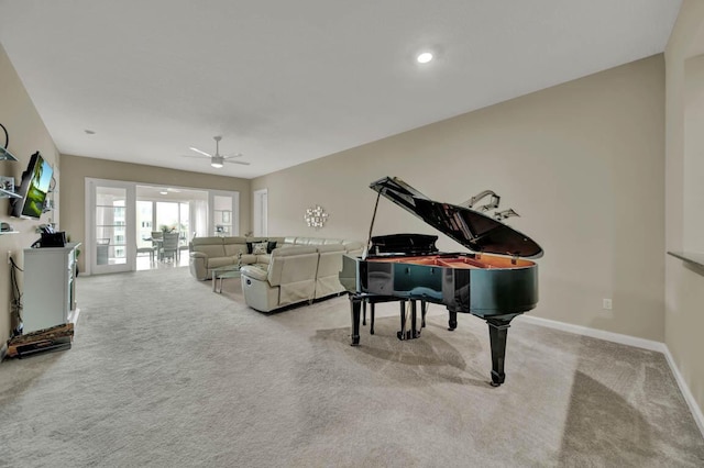 miscellaneous room with ceiling fan, light carpet, and french doors