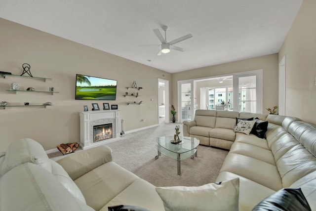 living room with carpet floors and ceiling fan